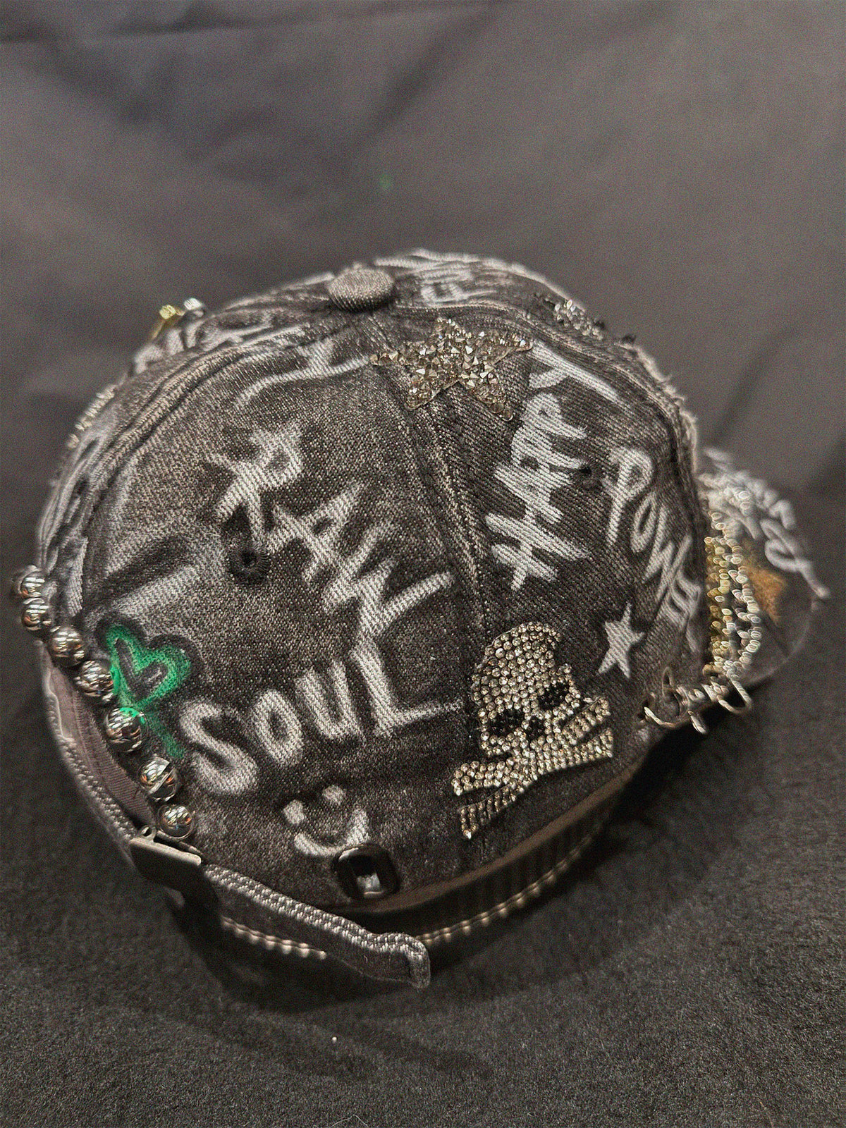 The RAW Star Black Denim Cap close-up detail — Skinner & Vale upcycled denim jacket