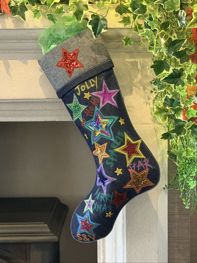 Tinsel Town Denim Christmas Stocking, hanging on a fireplace