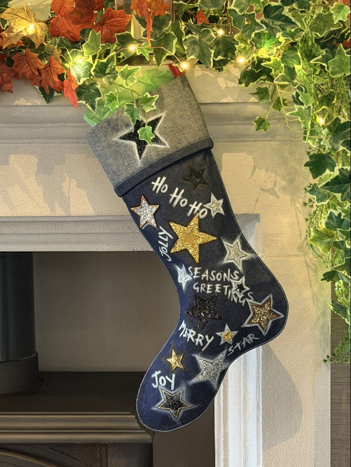 Silent Night Denim Christmas Stocking, hanging on a fireplace