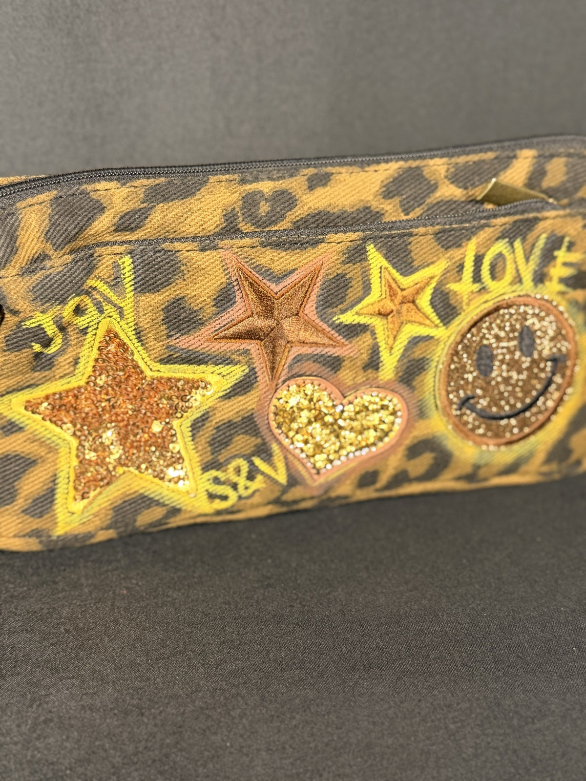 Eye of the Tiger Anything Pouch, close-up of the hand-applied patches