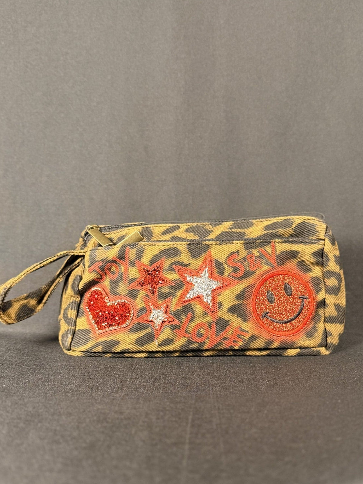 Love Shack Anything Pouch, shown on a grey backdrop