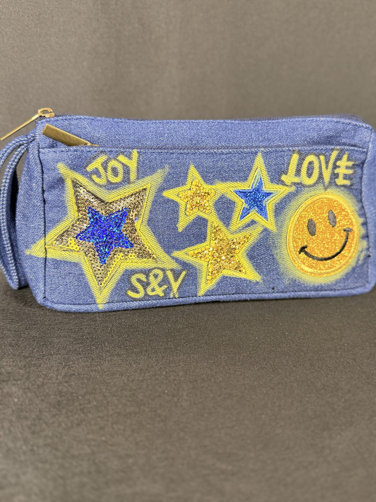 Walking on Sunshine Anything Pouch, close-up of the hand-applied patches
